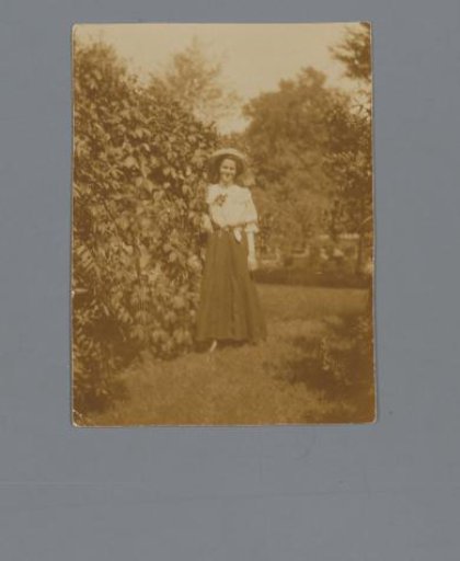 Portrait of an unknown woman in a garden
