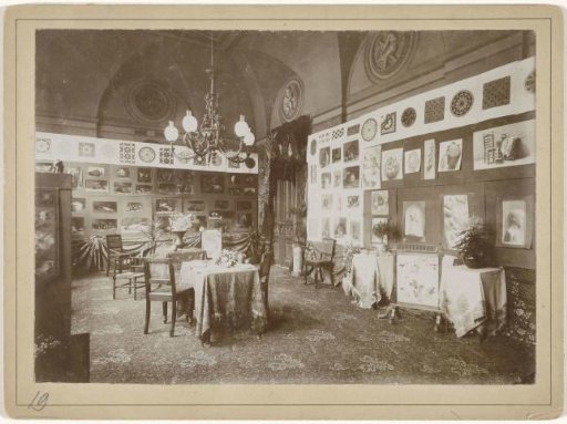 Room in the Rijksmuseum furnished as a salon with drawings and paintings on paper on the walls