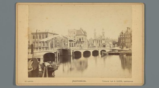 View of the Blauwbrug in Amsterdam, with the Moses and Aaron Church in the background