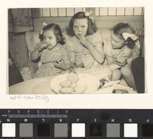 Beatrix, Queen of the Netherlands, Irene, Princess of the Netherlands, and Margriet, Princess of the Netherlands, eating biskuit with muisjes on the occasion of the birth of Christina, Princess of the Netherlands, on 18 February 1947