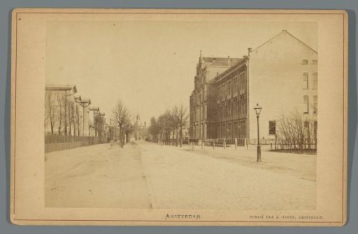 View of the Plantage Middenlaan with the St. Jacob's Institution on the right and the Muiderpoort in the background in Amsterdam