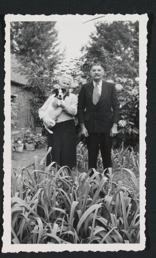 Man and Woman with a Dog Named Myra in a Vegetable Garden in Blicquy