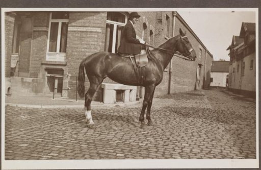 G.A. Urtebise in an equestrian costume sitting on a horse