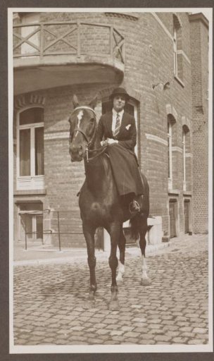 G.A. Urtebise in an equestrian costume sitting on a horse