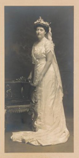 Portrait of a bride in a long dress with a train