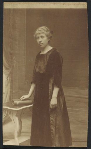 Portrait of a woman in a long dress, designated as Ami