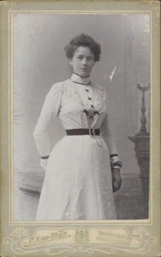 Portrait of a woman in a dress with a sash