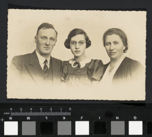 Portrait of (presumably) a married couple with daughter