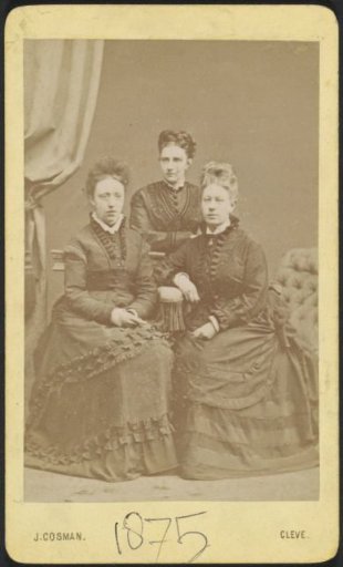 Portrait of three women in dresses