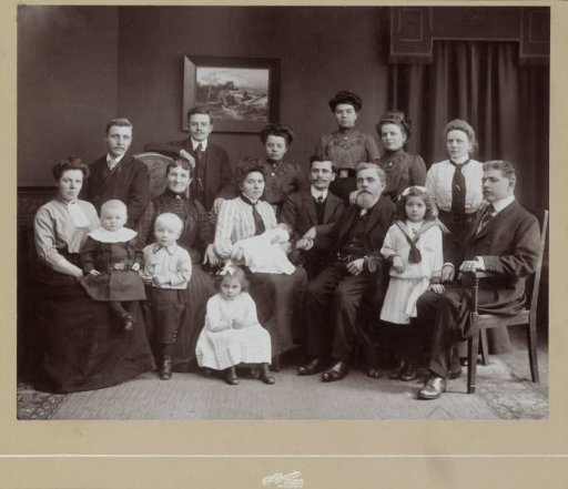 Group portrait of a family in a living room