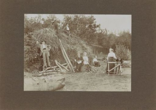 Men and Women Posing at a Sawmill