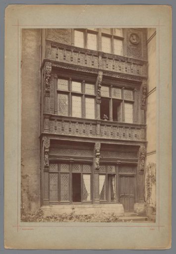Wooden house with carved decorations of human figures, colonnettes, and plant motifs in Rouen