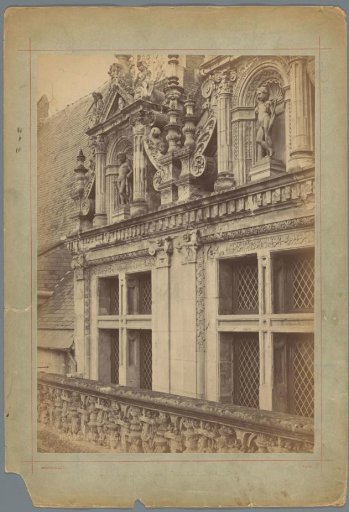 Dormer windows of the Château of Blois ornamented with a pediment and a niche containing a sculpture of a boy