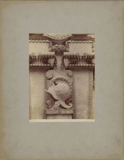 Fireplace from the Château d'Écouen decorated with helmets and a woman holding a sword and a laurel wreath