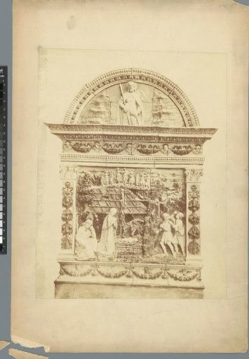 Relief in a tympanum between two columns, depicting the birth of Christ and Christ as an adult man