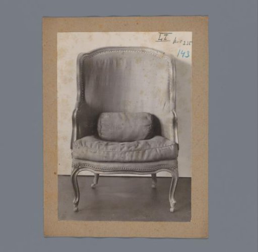 Chair with wheels under the legs and a cushion in the backrest