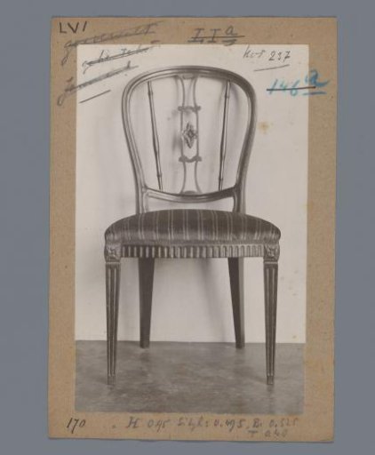 Mahogany chair with an open curved and profiled back featuring a floral detail, in the Rijksmuseum, Amsterdam