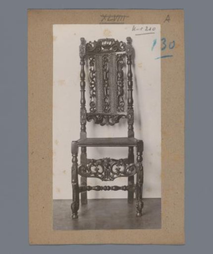 Chair decorated with volutes, a crown, and a coat of arms (possibly) in the Rijksmuseum, Amsterdam