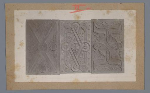 Three wooden panels decorated with floral motifs and lines