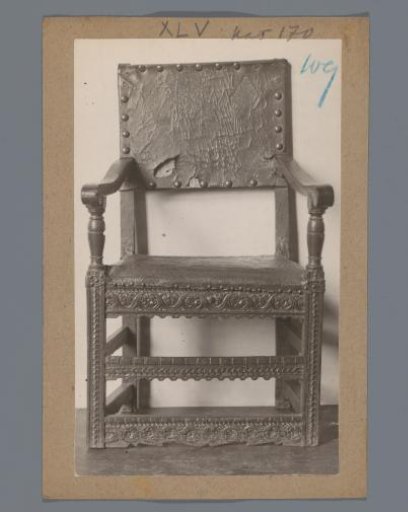 Oak armchair decorated with a braided band in the Rijksmuseum, Amsterdam