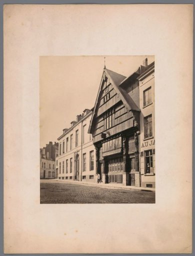 Wooden facade of an antique shop with atlantes