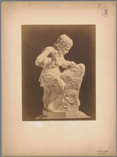 Statue (or cast of a statue) of a boy sculpting