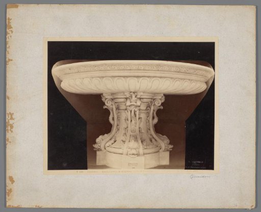 Basin decorated with dolphins