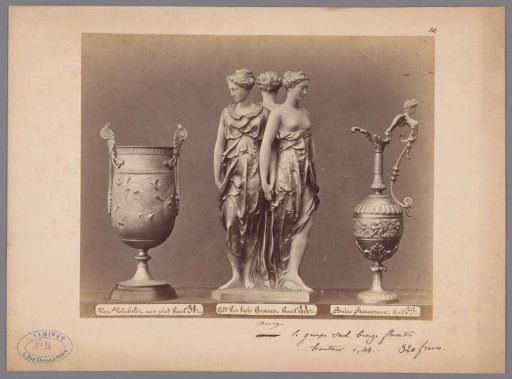 View of a vase, a sculpture, and another vase