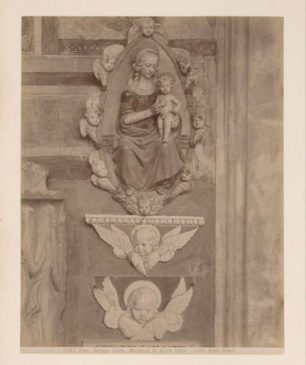 Sculpture of Madonna with Child in terracotta after Luca della Robbia in the Camposanto in Pisa, Italy