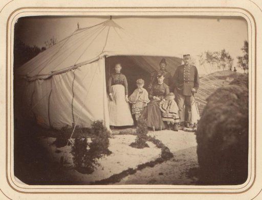 Family portrait in front of a tent