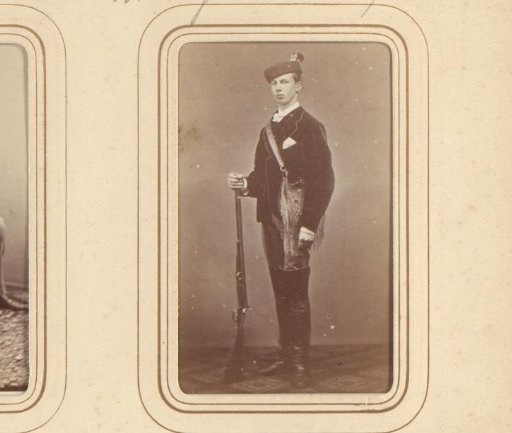 Portrait of a man in hunting costume with a hunting rifle
