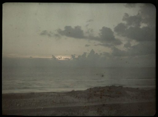 Sunset over the Sea, with a Dune in the Foreground