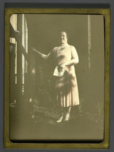 Portrait of Tine, Outdoors Holding the Book Swan Song