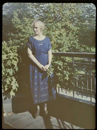 Portrait of Fifi standing on a balcony