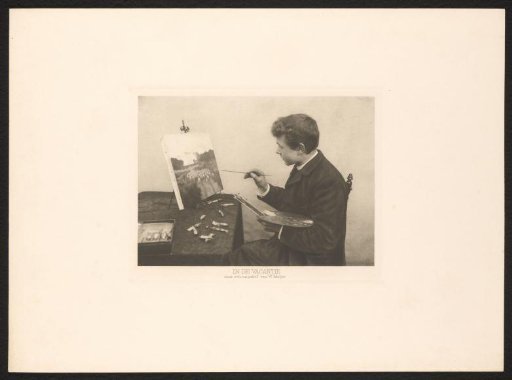 Boy painting a landscape