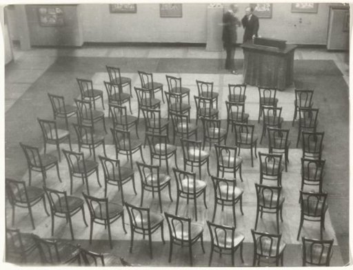 Karl With and Konrad Adenauer in an Empty Hall with Chairs, Possibly the Museum für Kunstgewerbe in Cologne