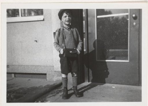 Boy in Front of a House