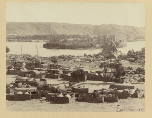 View of the island of Philae, with a village in the foreground