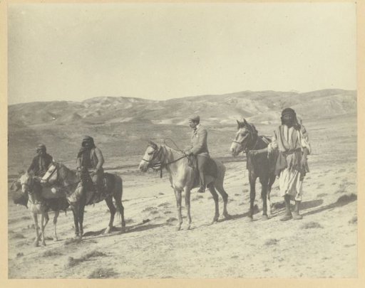 Richard Polak and fellow travelers on horseback in a desert
