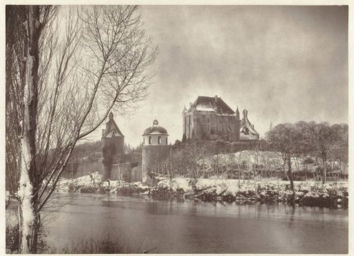 Snow-covered Château de Touffou in Bonnes, France