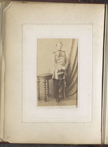 Portrait of a soldier with a cap and sabre in hand