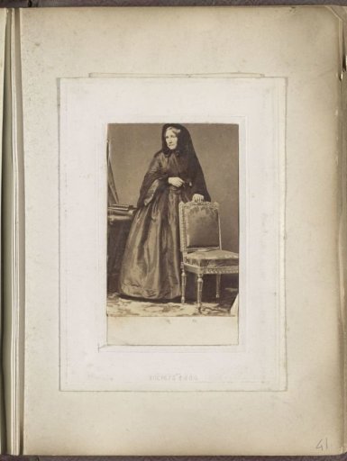 Portrait of a woman in a long dress with a veil