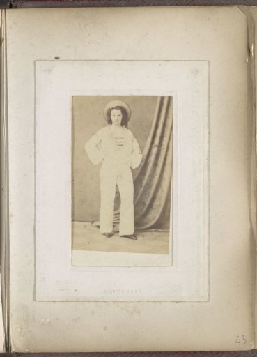 Portrait of a young woman in a sailor suit
