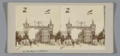 Van Woustraat viewed towards the Westeinde, decorated with a triumphal arch for the inauguration of Queen Wilhelmina, Amsterdam