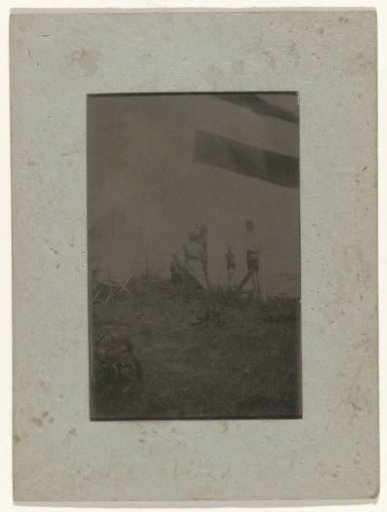 Hoisting the Dutch flag on the beach at Valkeveen