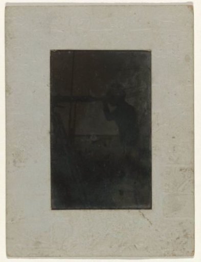 Boy looking through a telescope