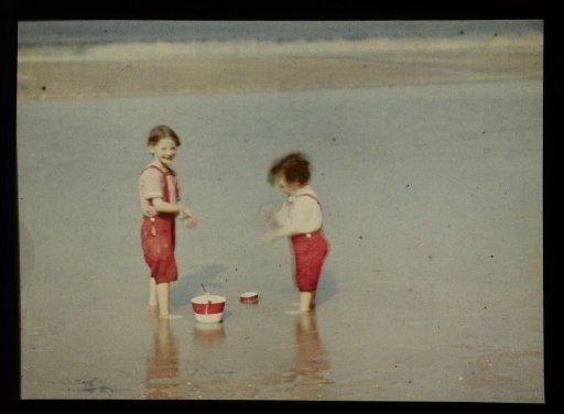 Two children playing on the North Sea beach