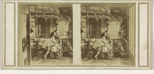 Girl Embracing a Woman Sitting Behind a Spinning Wheel
