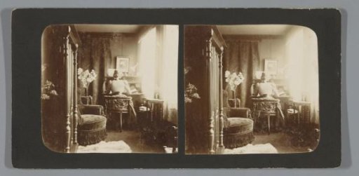 Cornelia Margaretha Scheltema Beduin behind a desk in her room, Singel 256, Amsterdam