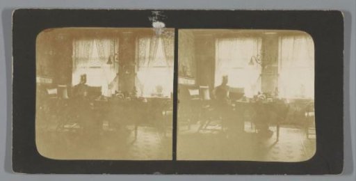 Woman at a coffee table in the back room of Singel 256, Amsterdam, Netherlands